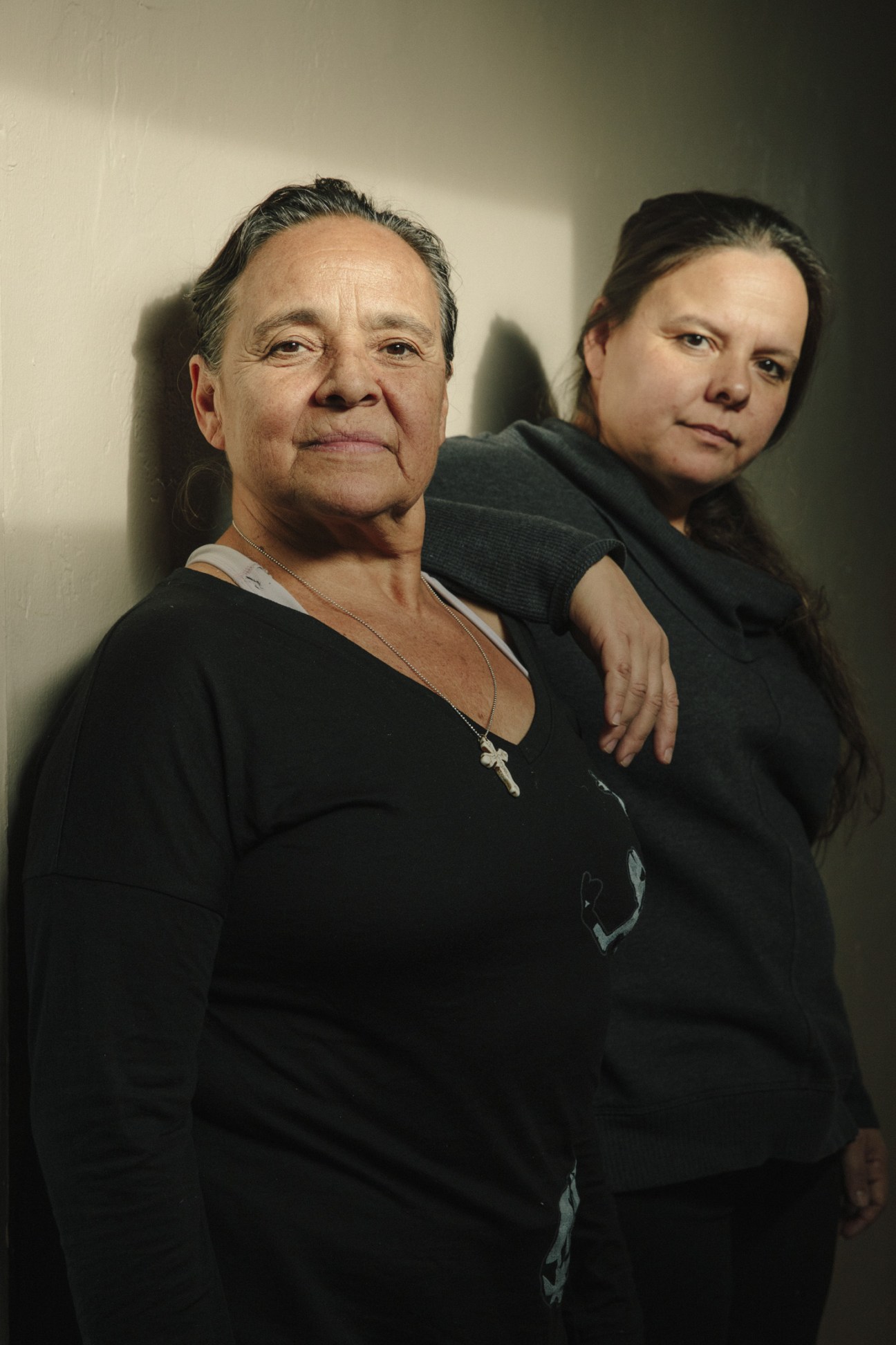 Eva Encinias and Marisol Encinias, members of Albuquerque's prominent flamenco dancing family, pose together against a neutral background.