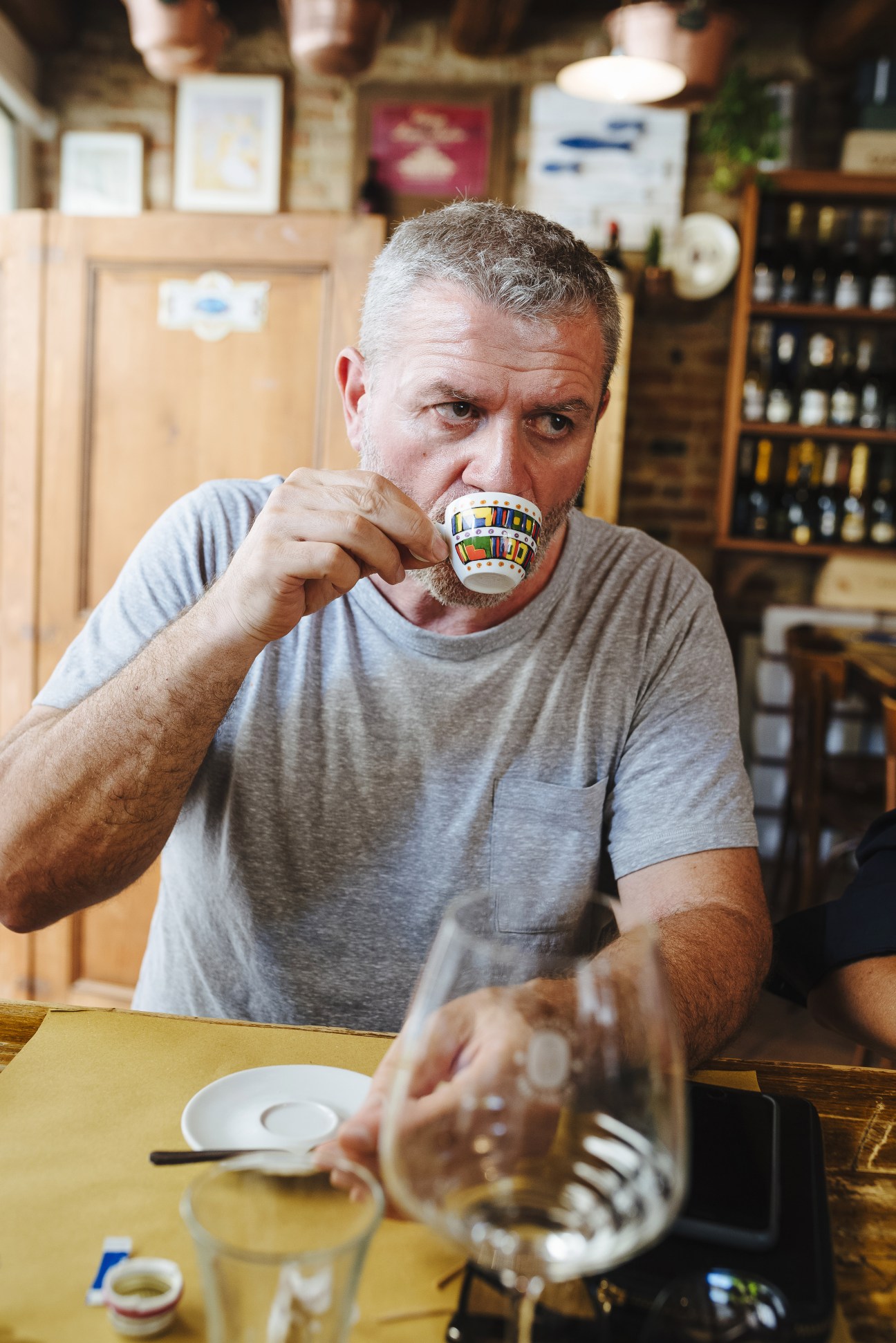 Massimo Pigozzo sips espresso from a decorative cup in Barena's studio.