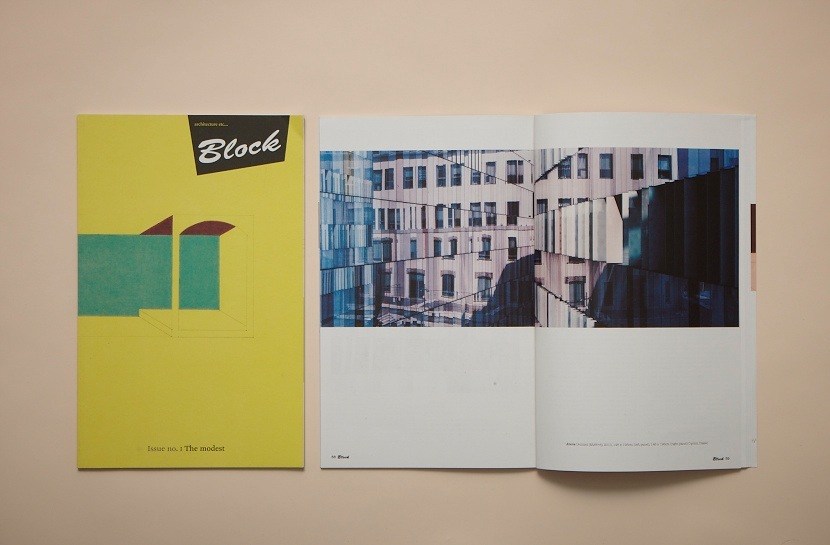 Block architecture magazine with yellow cover and open spread showing urban building photograph.