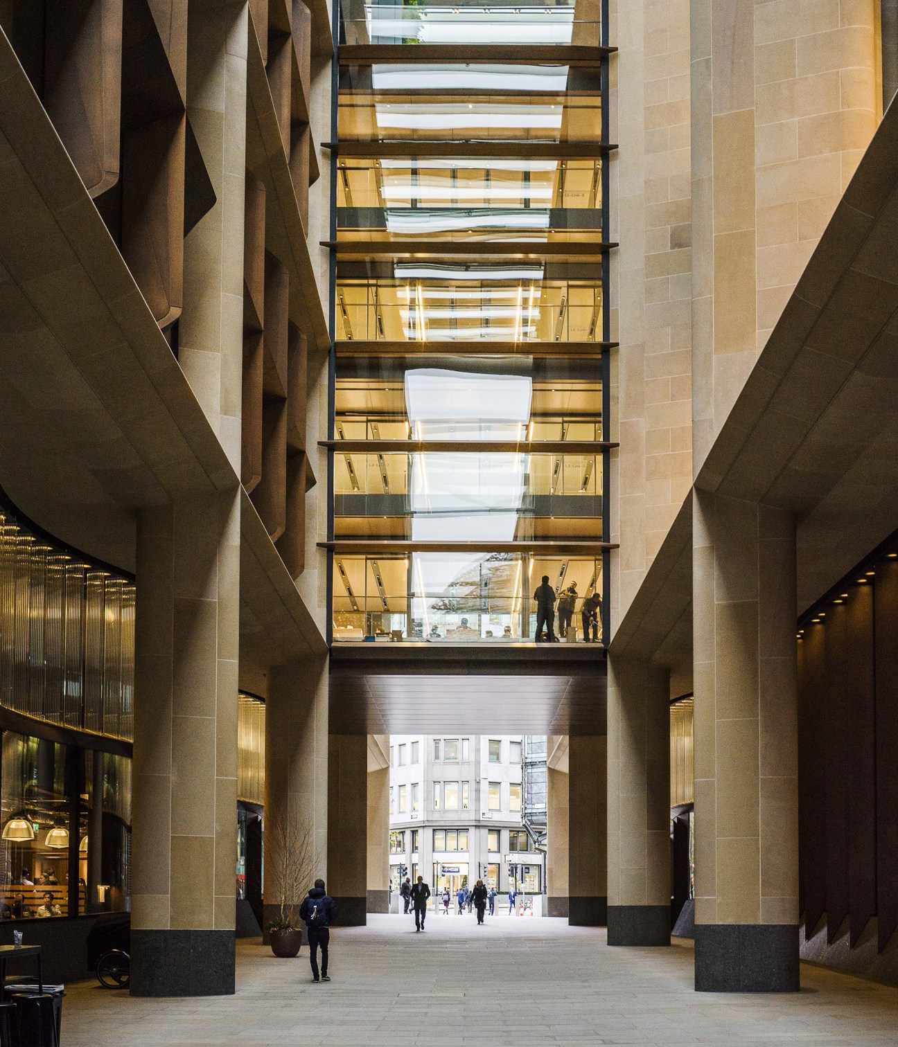Modern glass bridge connecting two parts of Bloomberg building with sleek architectural design