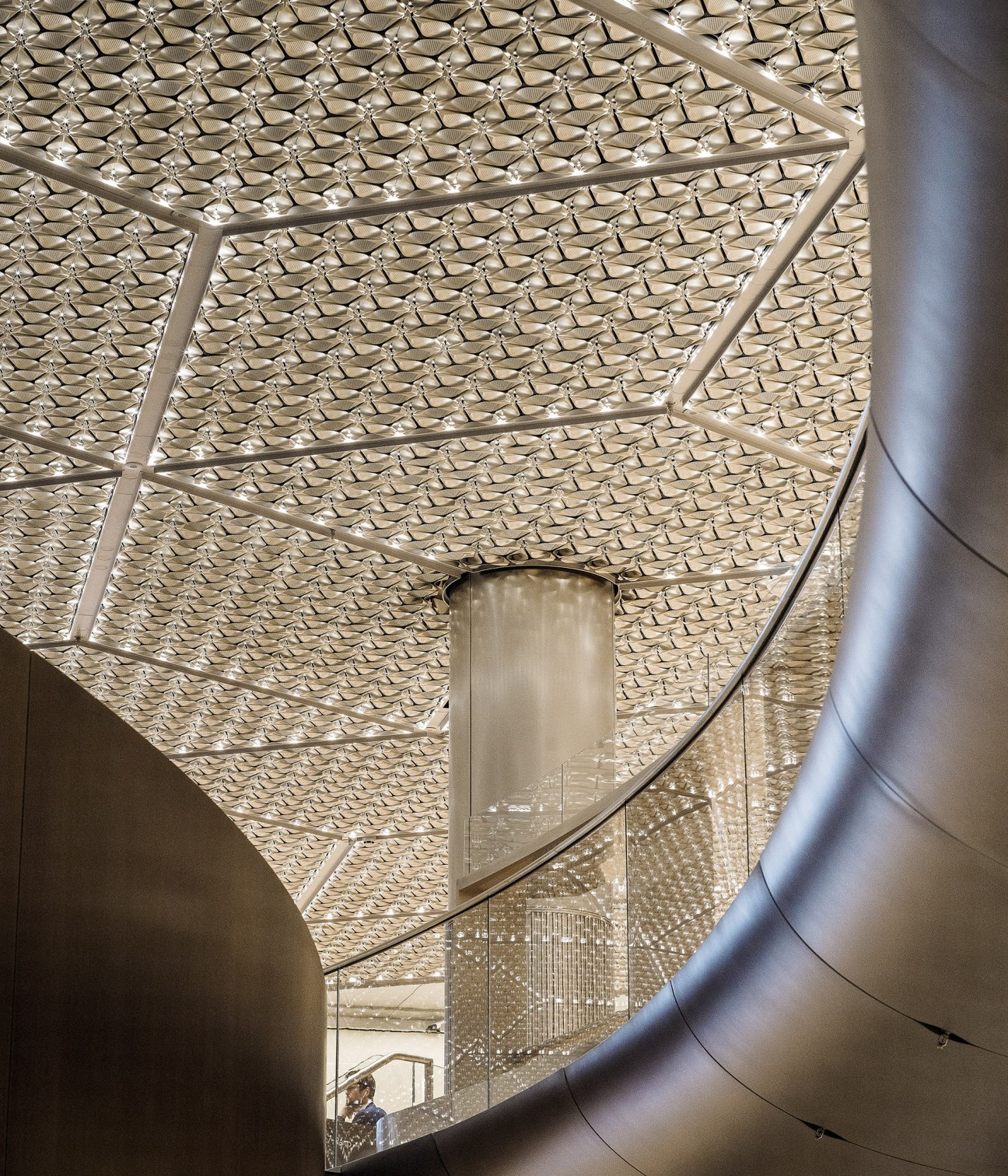 LED lighting fixtures designed as polished aluminium petals creating atmospheric office lighting