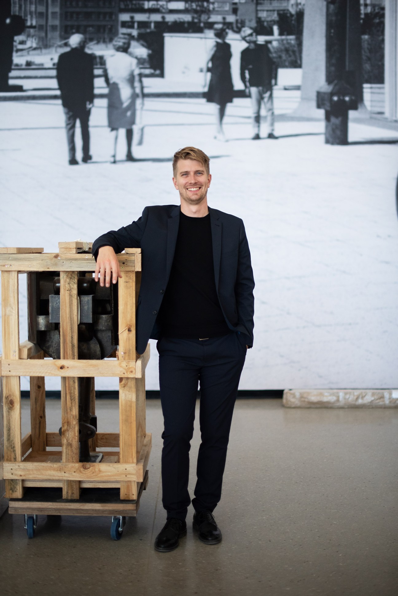 Owen Martin, chief curator of Norval Foundation, poses with wooden art installation.
