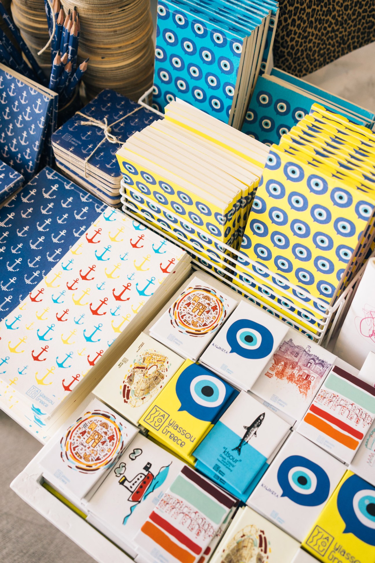 Colorful notebooks, souvenirs and local products displayed at Yiassou shop in Kavala.