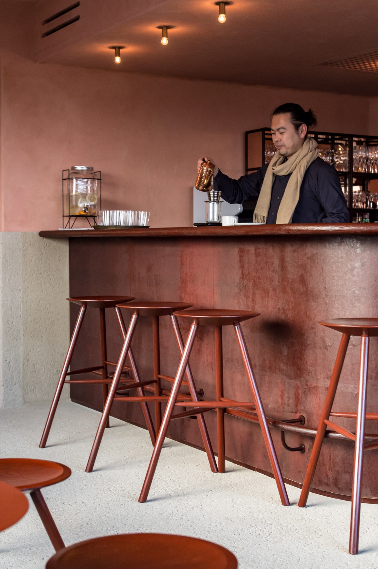 General manager Takanobu Yoshida preparing tea at the hotel bar in Lantern Onomichi Garden.