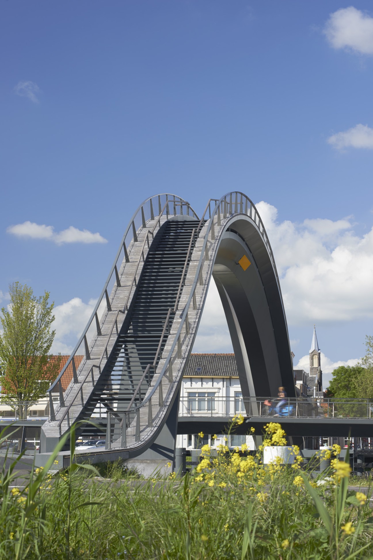 Melkwegbridge in Purmerend, a pedestrian and cyclist bridge with a dramatic high arching span, designed by Next Architects.