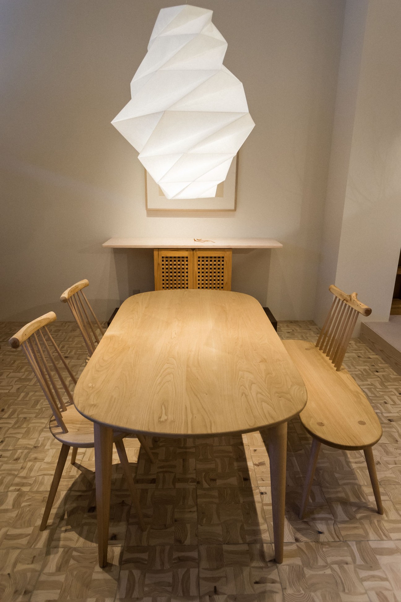 Kinoe dining set by Ibuki Kaiyama for Hida Sangyo featuring a wooden table with chairs and overhead lamp.