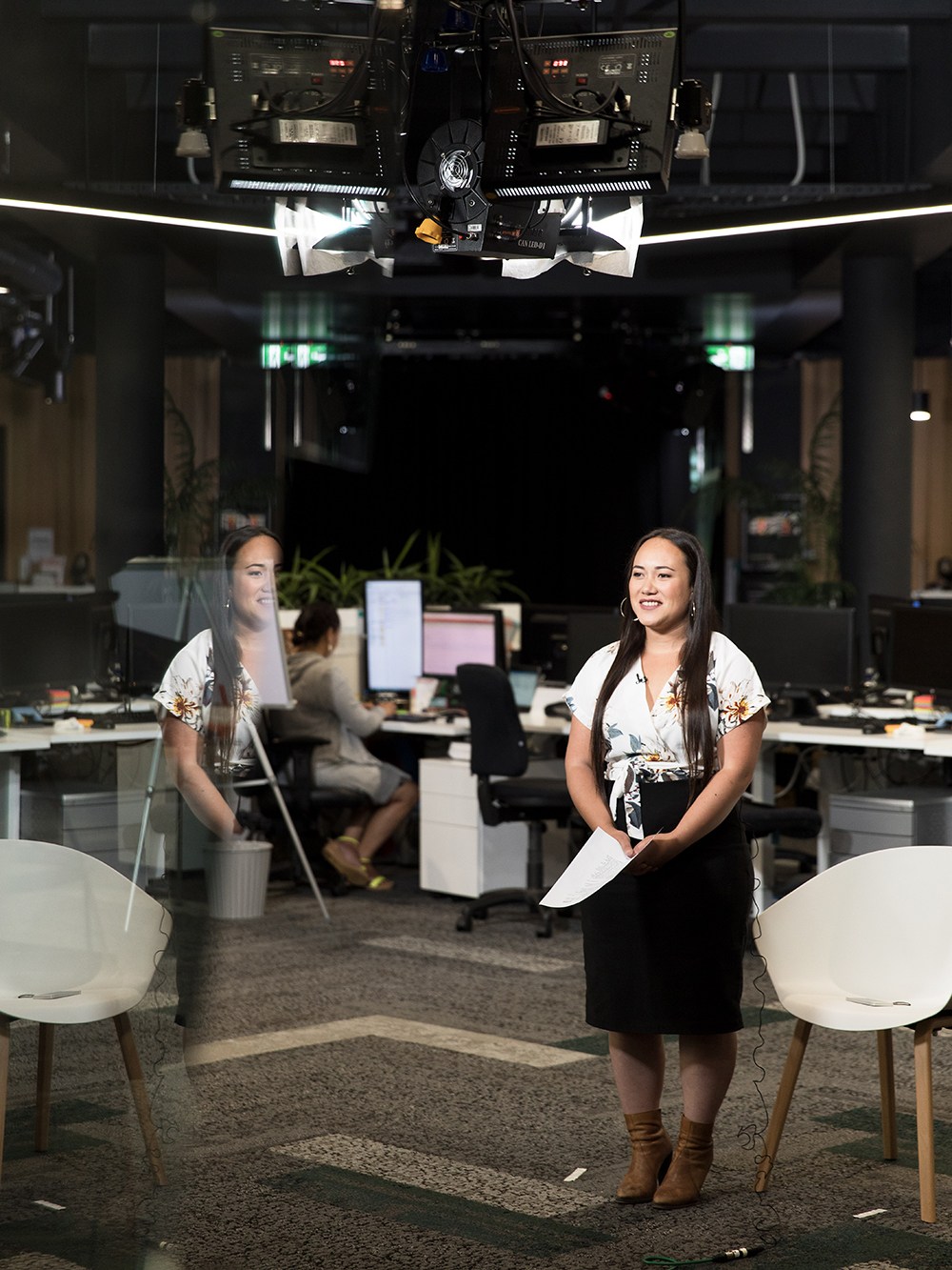 Moana Makapelu-Lee, a reporter for Maori Television's news and current affairs, being filmed in the studio with professional lighting.