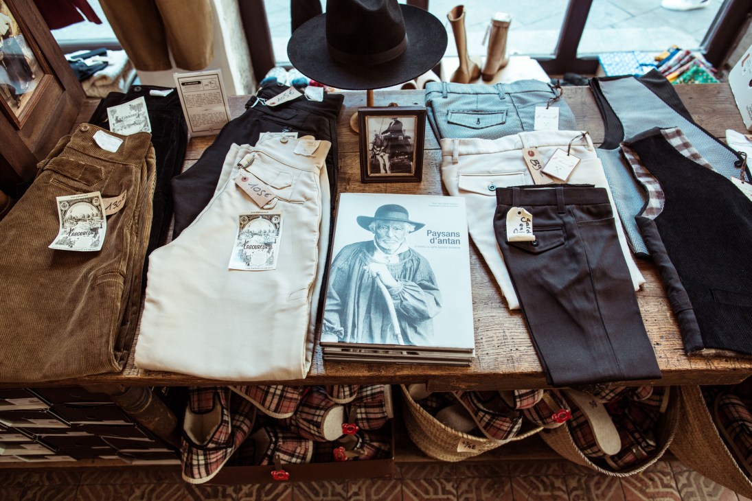 Display of traditional gardian herdsmen trousers and workwear at Maison Empereur.