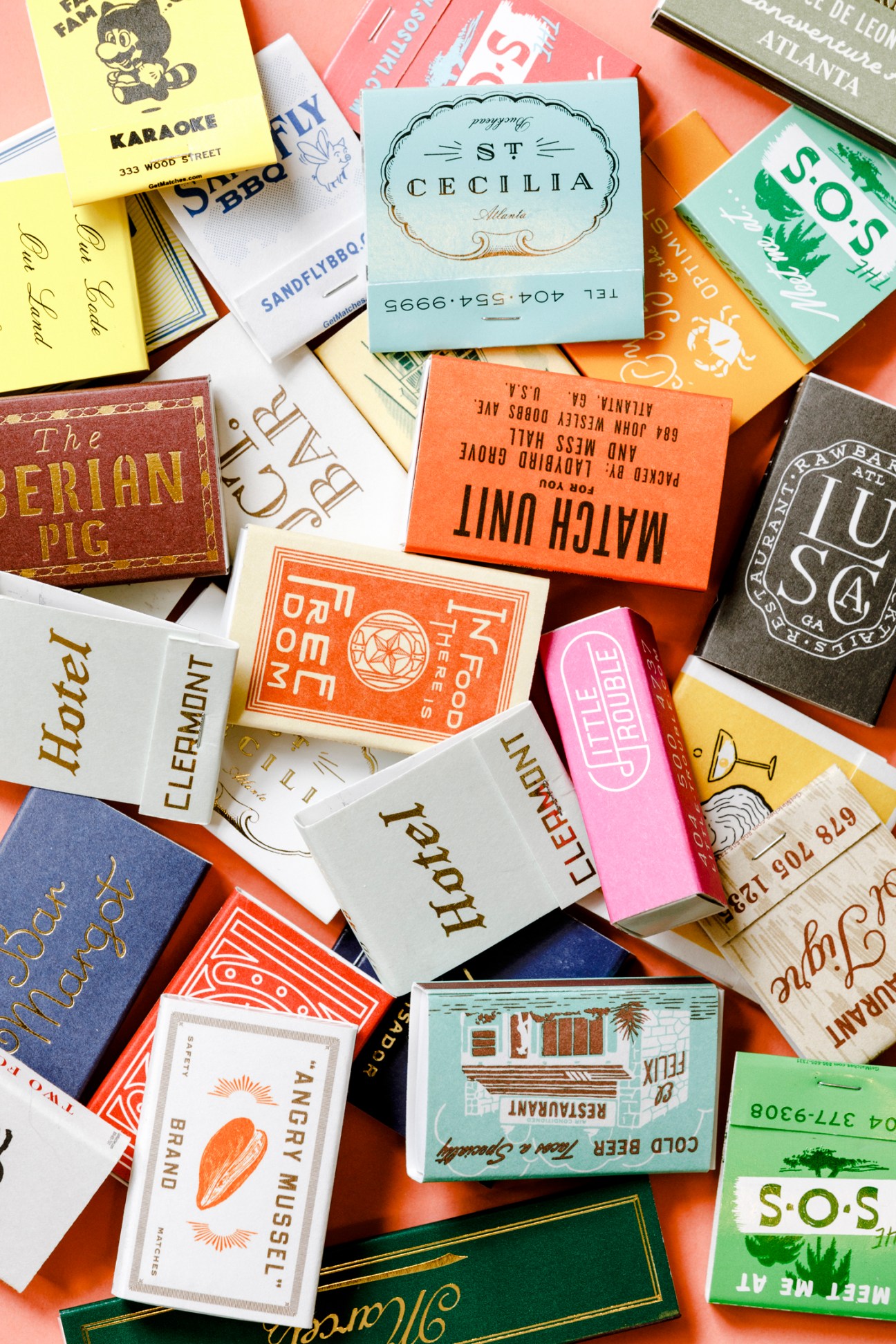 Collection of colorful matchbooks showing Family Brothers' design work for various restaurants and bars