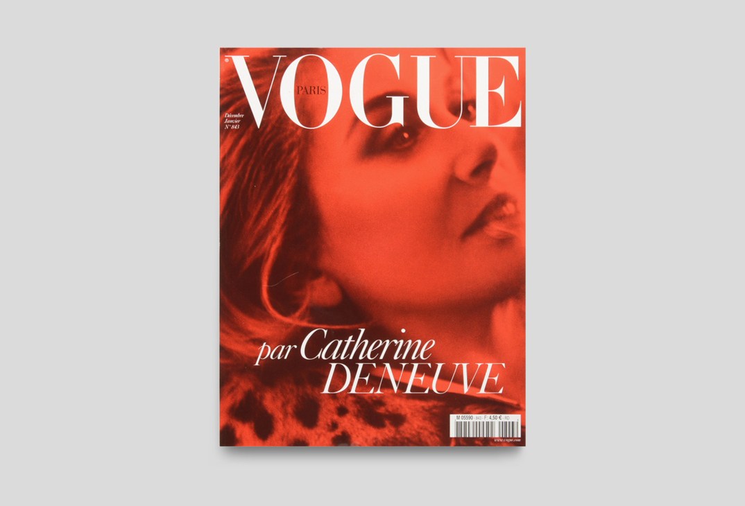 Vogue Paris magazine cover with red-toned portrait and white typography, December 2003/January 2004 issue.