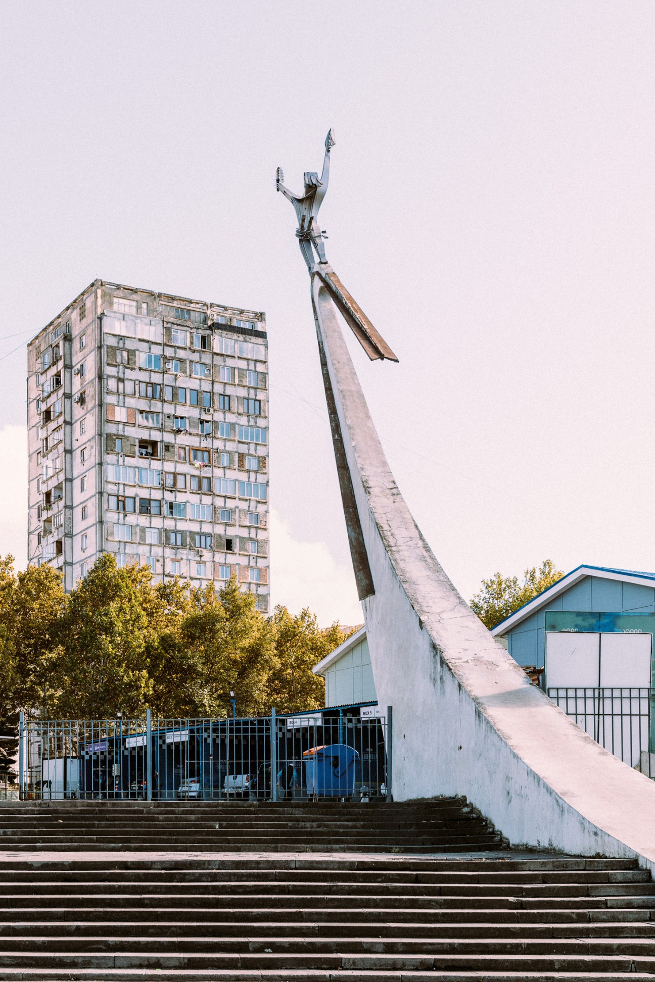 Soviet-era statue of a figure with raised arms at ExpoGeorgia exhibition centre in Tbilisi.