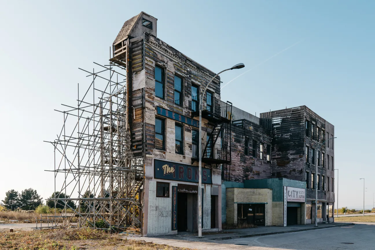 Abandoned New York street set with weathered brick buildings and scaffolding from Hellboy II film production.