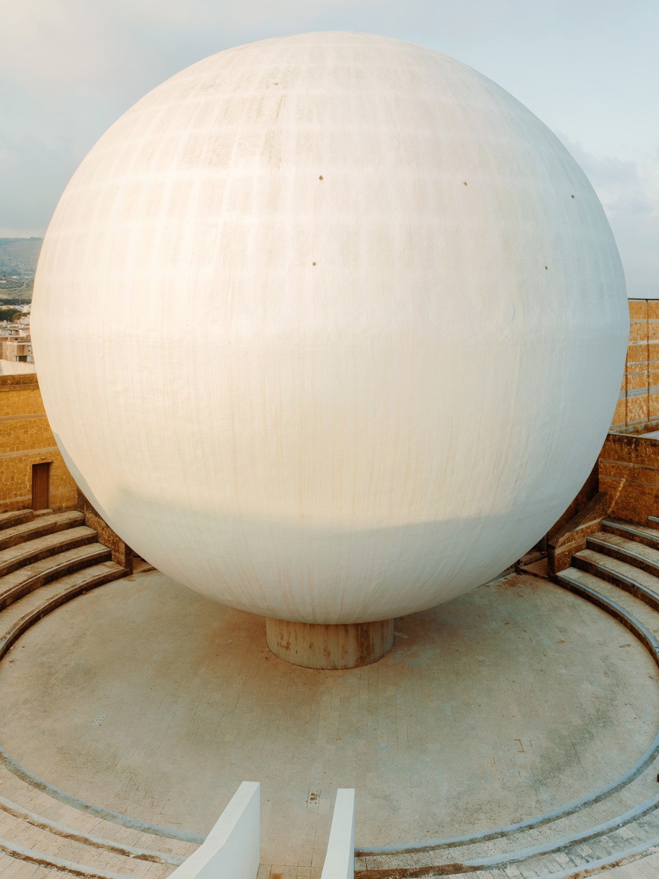 White spherical church building with modern architecture, the Chiesa Madre by Ludovico Quaroni