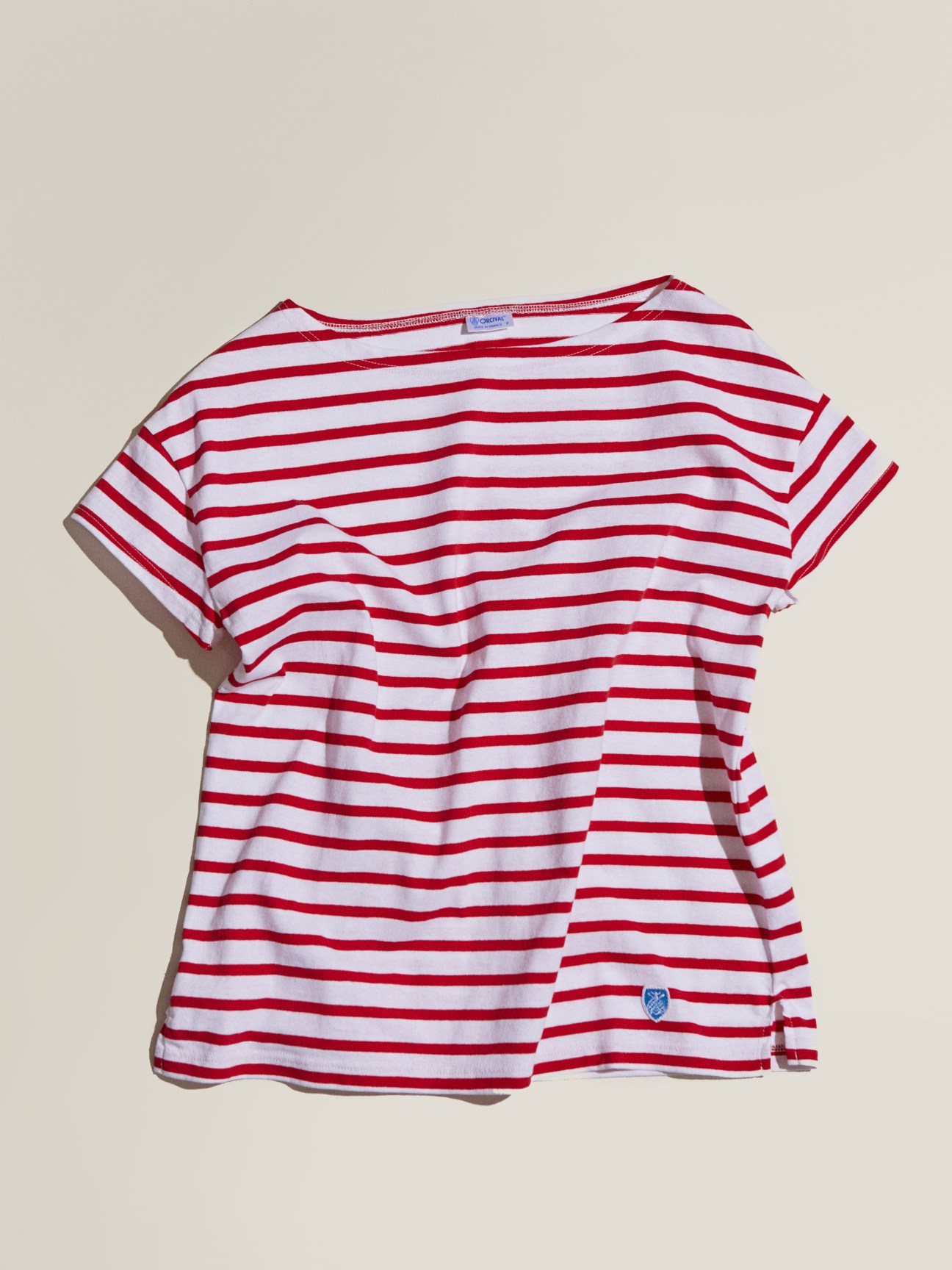 Red and white striped t-shirt by Orcival against a neutral background.
