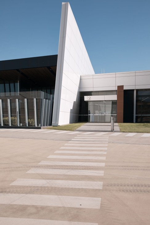 Brisbane West Wellcamp Airport terminal building with white angular architecture and entrance marked with number 2.