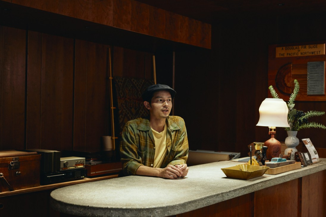 Daisuke Matsushima, owner of Tokyo furniture shop Bullpen, stands behind the counter in his store.