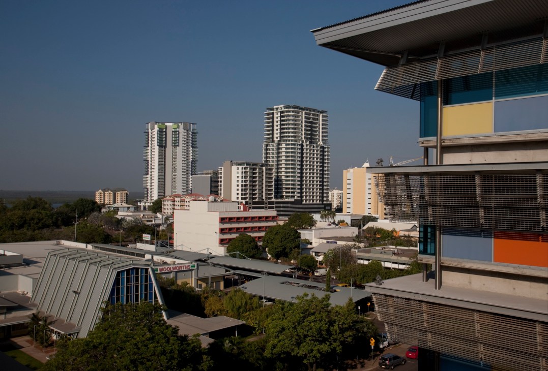 Darwin's skyline showing high-rise residential towers and modern buildings under a clear blue sky.