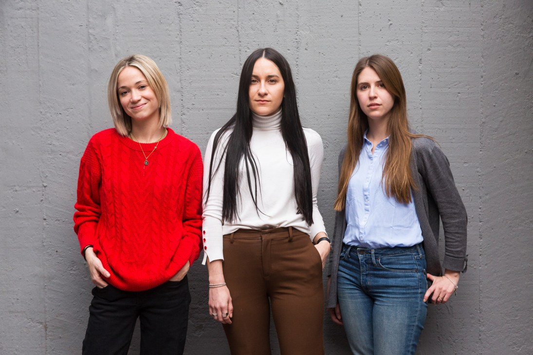 Three women standing against a grey concrete wall: Cristina Arreola, Vanessa Santos, and Debbie Kennedy of design studio Parametro.