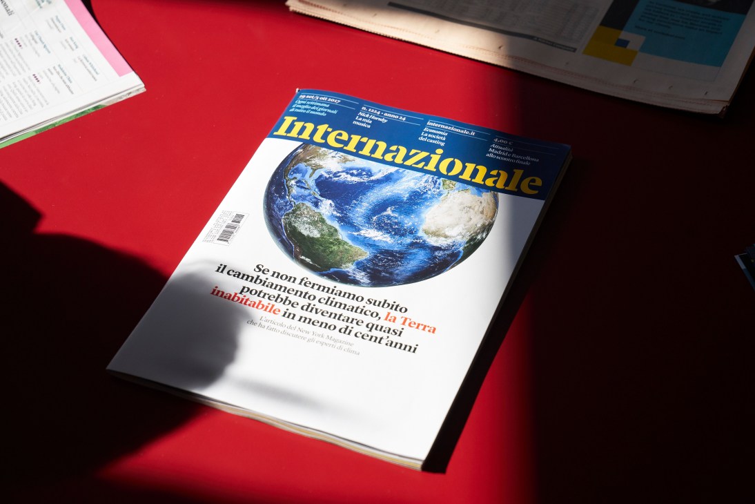Internazionale magazine cover featuring Earth with yellow masthead text on navy blue background