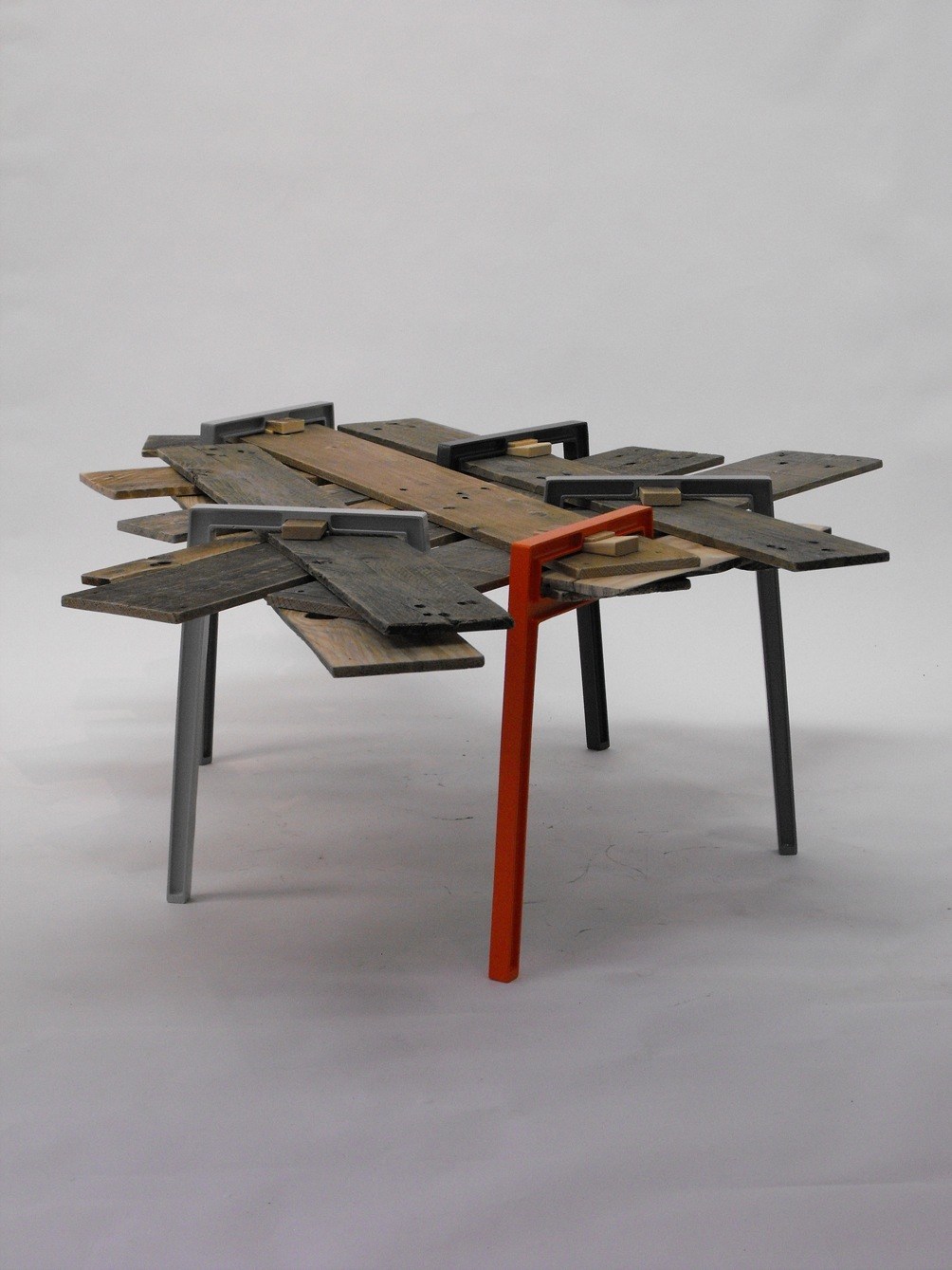 Modern table with reclaimed wood top and cast-aluminium image by David Amar titled Raymond.