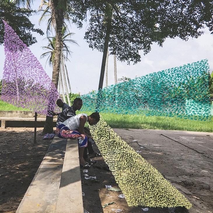 Person embroidering bright yellow thread onto a photograph mounted on a bench, with purple and teal embroidered panels visible in background.