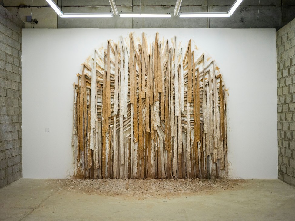 Zahrah Al Ghamdi's 'Landscape of Islam' installation featuring wooden strips arranged in an arched pattern.