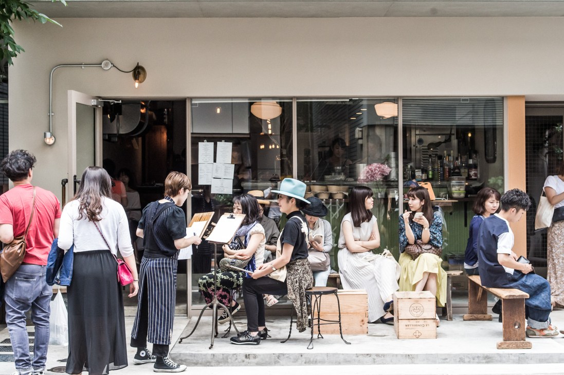 Customers queue outside Path restaurant in Tokyo's Tomigaya neighborhood.
