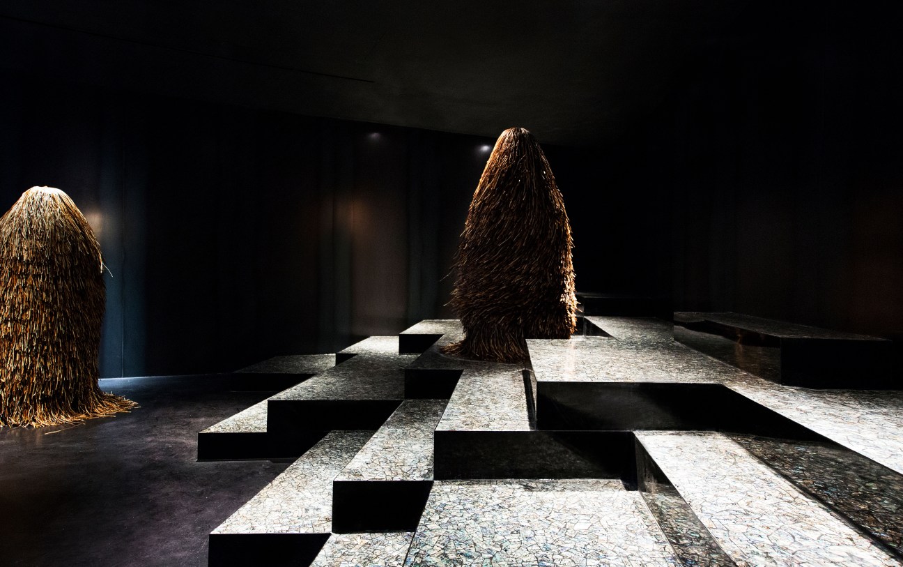 Interior of Gentle Monster LA shop with sculptural fiber installations and checkered floor design.