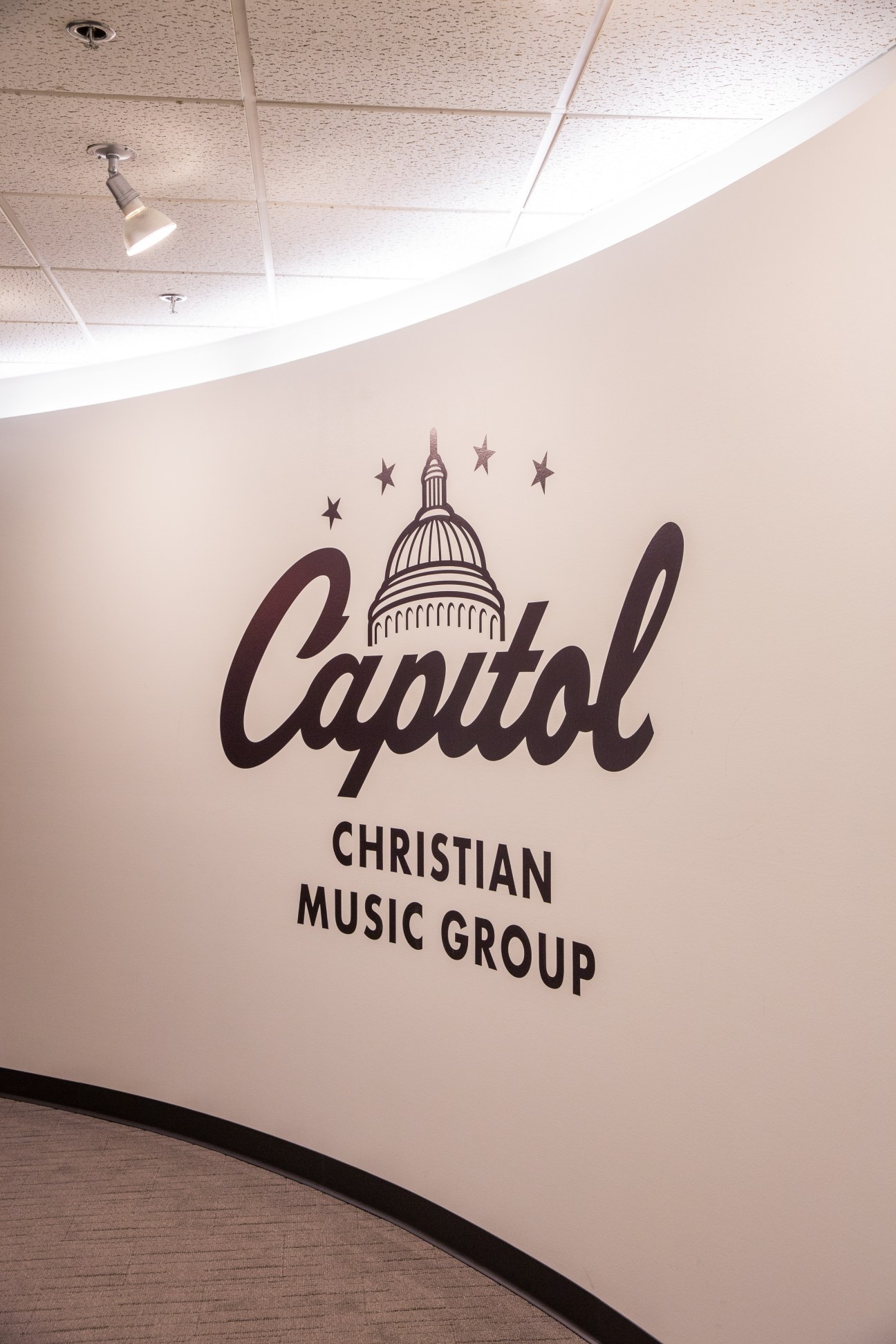 Capitol Christian Music Group logo and signage on a white wall at their headquarters in Brentwood, Nashville.