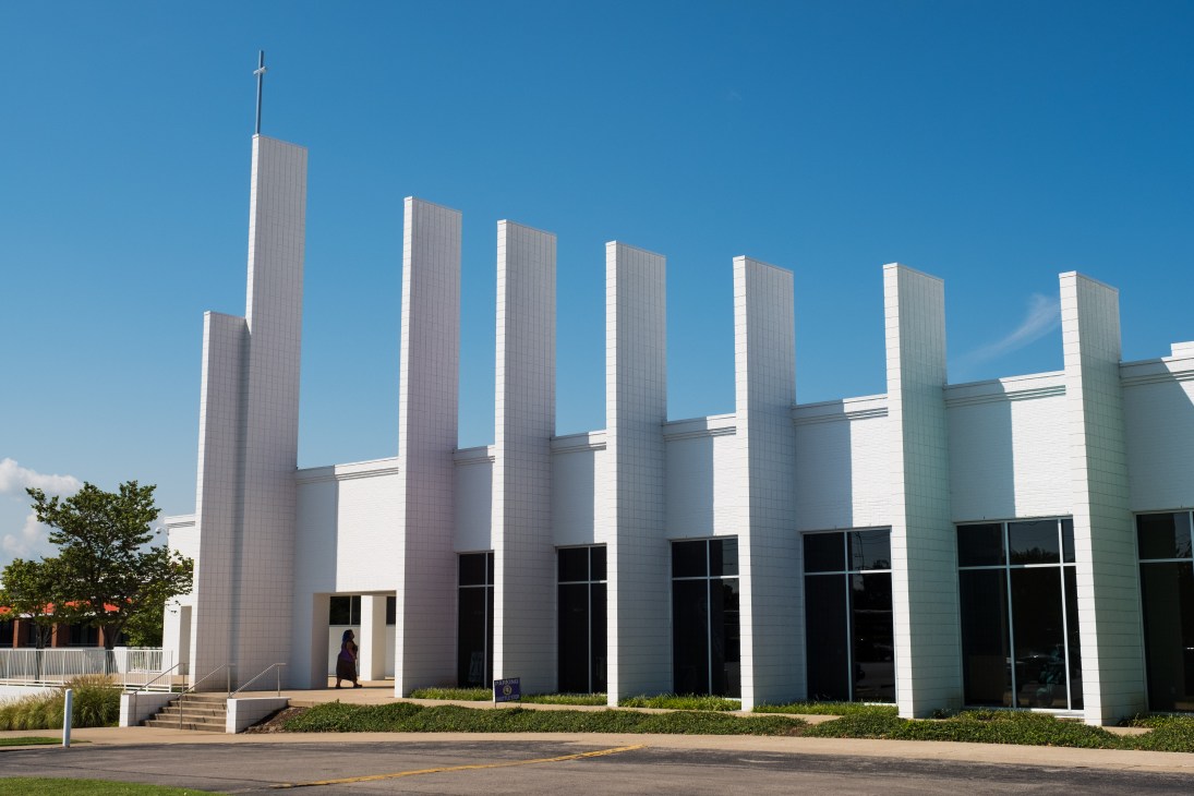 Mount Zion Baptist Church in Nashville with white exterior and tall vertical columns, cross atop tallest spire.