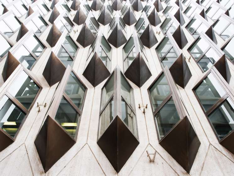 Art deco AXA Insurance building with distinctive curved balconies and geometric patterns