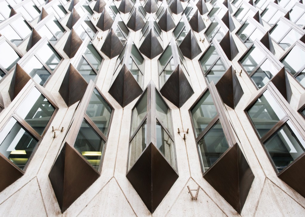 Art deco AXA Insurance building with distinctive curved balconies and geometric patterns