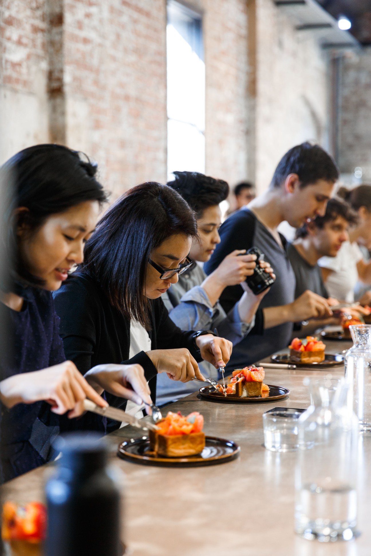 Customers sampling pastries at a Lune Lab degustation event in Melbourne.