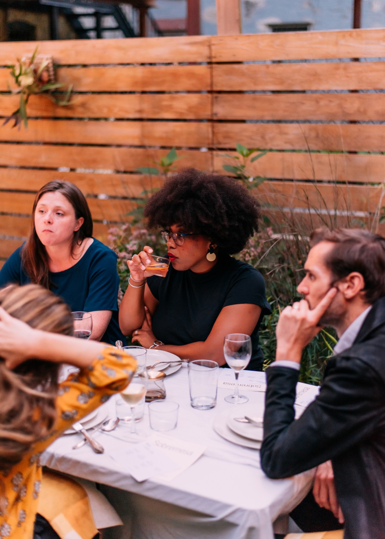 Garden dining scene in Brooklyn backyard