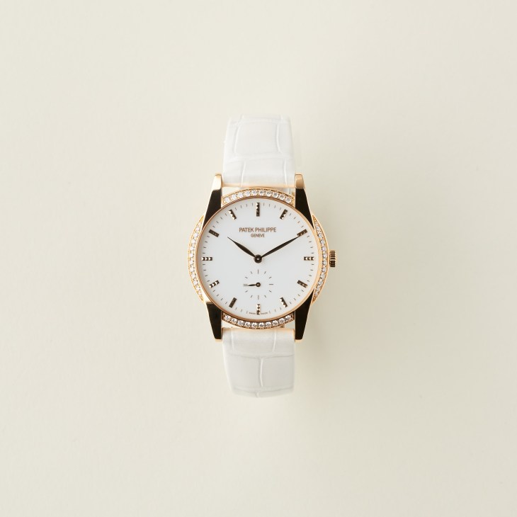 Patek Philippe Calatrava watch in rose gold with white dial and white leather strap