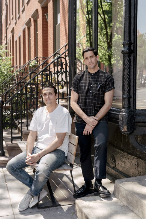 Two men posing outside a brick building on Crosby Street, Saturdays NYC co-founders Colin Tunstall and Morgan Collett.