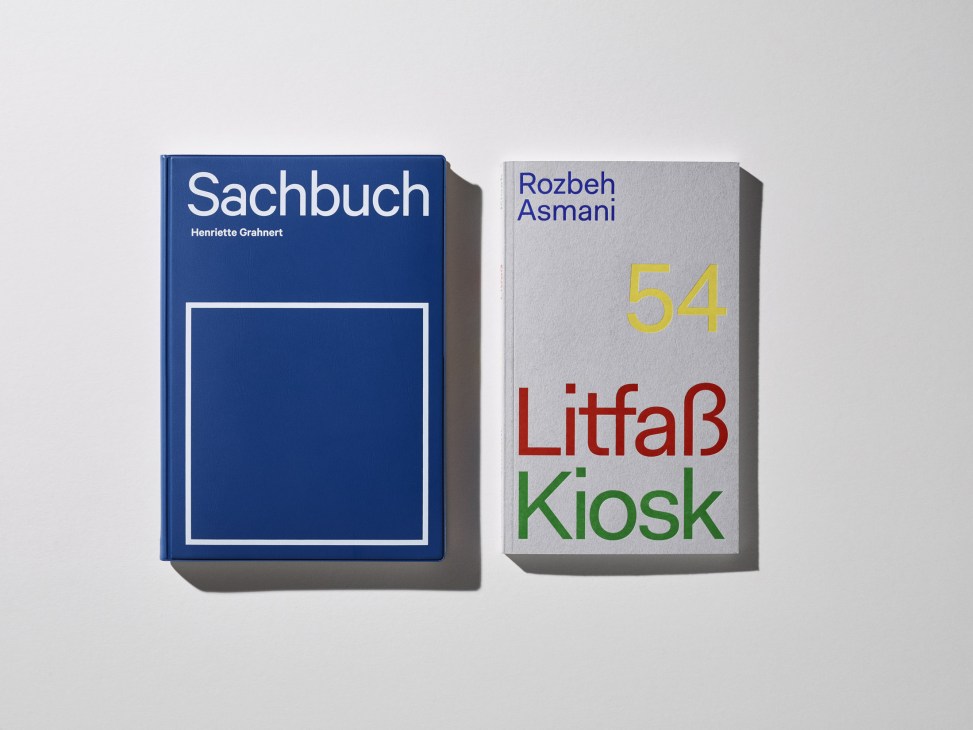 Two hardcover books displayed side by side: a blue book titled 'Sachbuch' by Henriette Grahnert, and a light gray book titled '54 Litfaß Kiosk' by Rozbeh Asmani.