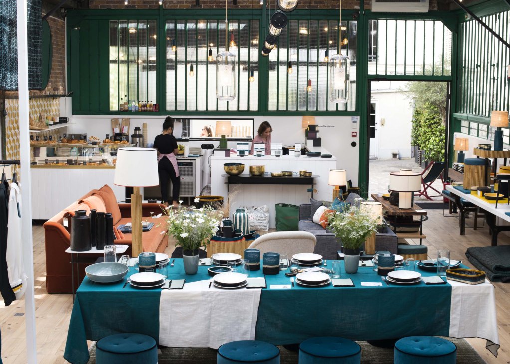 Sarah Lavoine's showroom displaying tableware, furniture and home décor in signature blue and terracotta tones.