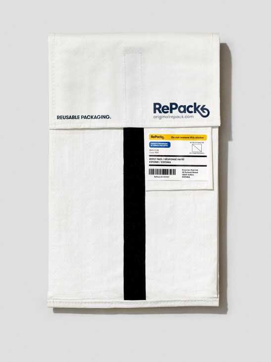 RePackS reusable white cloth mailer bag with black stripe and return shipping label.