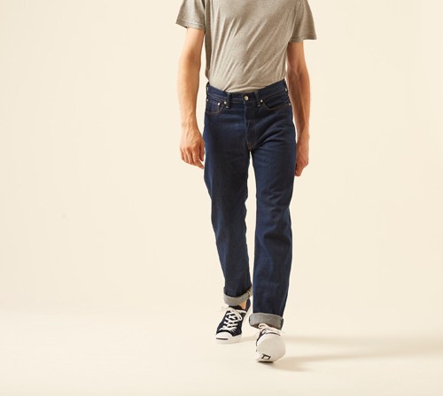 Person wearing organic cotton AI indigo denim by 45R in relaxed wide-leg cut with natural indigo dyeing.
