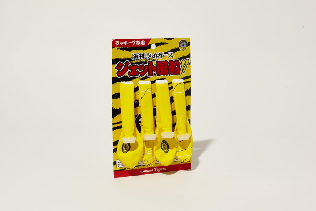 Hanshin Tigers branded yellow jet balloons for the Lucky 7 seventh inning tradition displayed on product packaging.