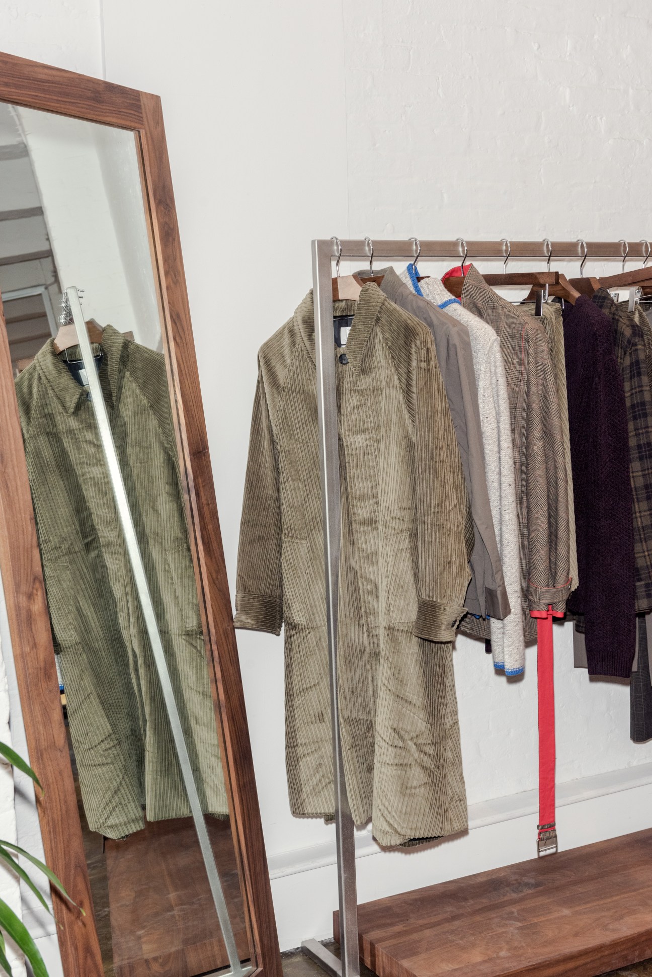 Deveaux clothing displayed on a rack including a plush moss corduroy coat for autumn 2018.