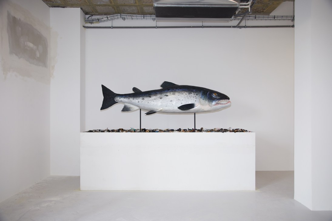 Contemporary art installation featuring curved sculptural elements in a gallery space