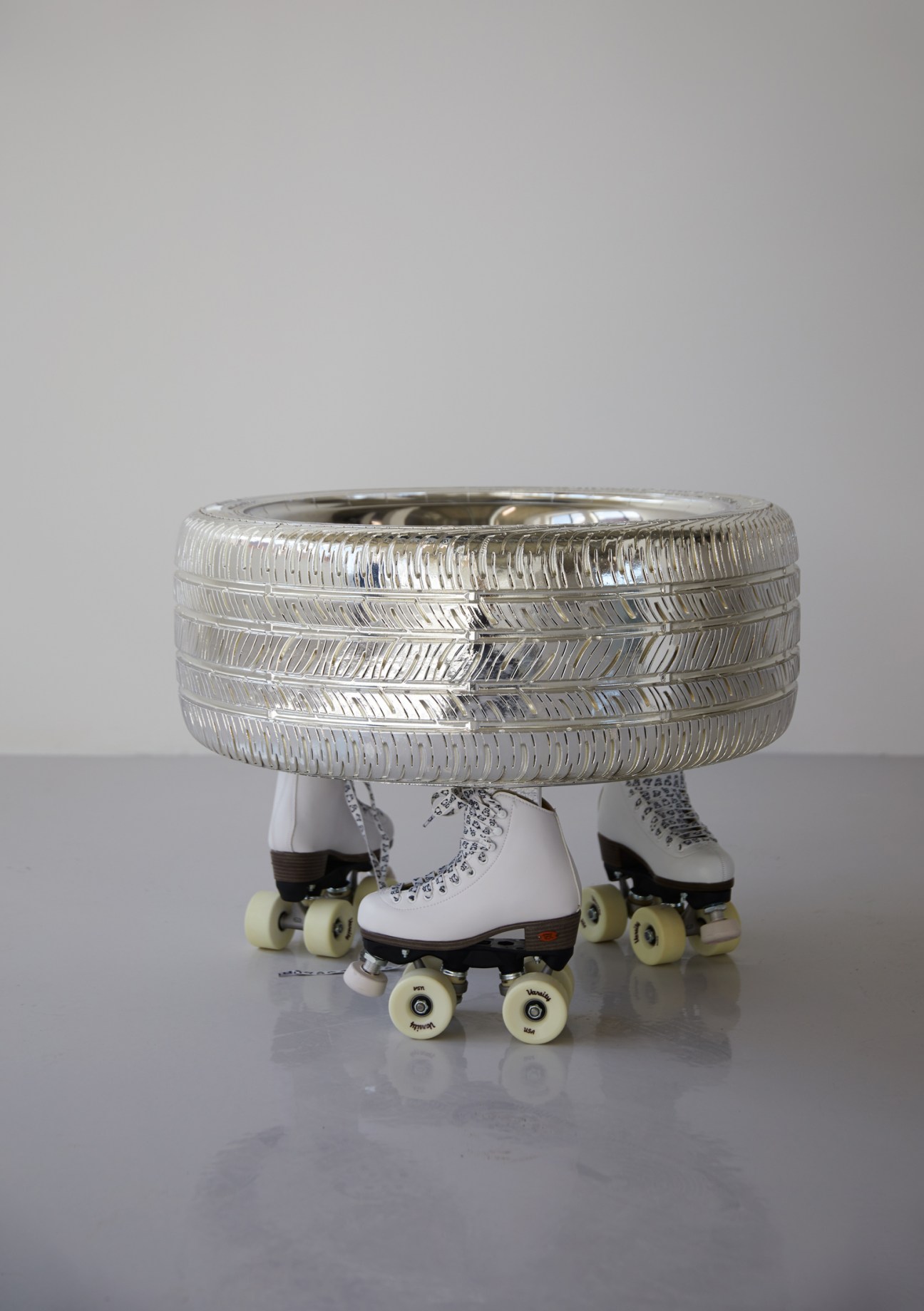 Contemporary sculptural artwork featuring colorful spherical elements on a table-like structure