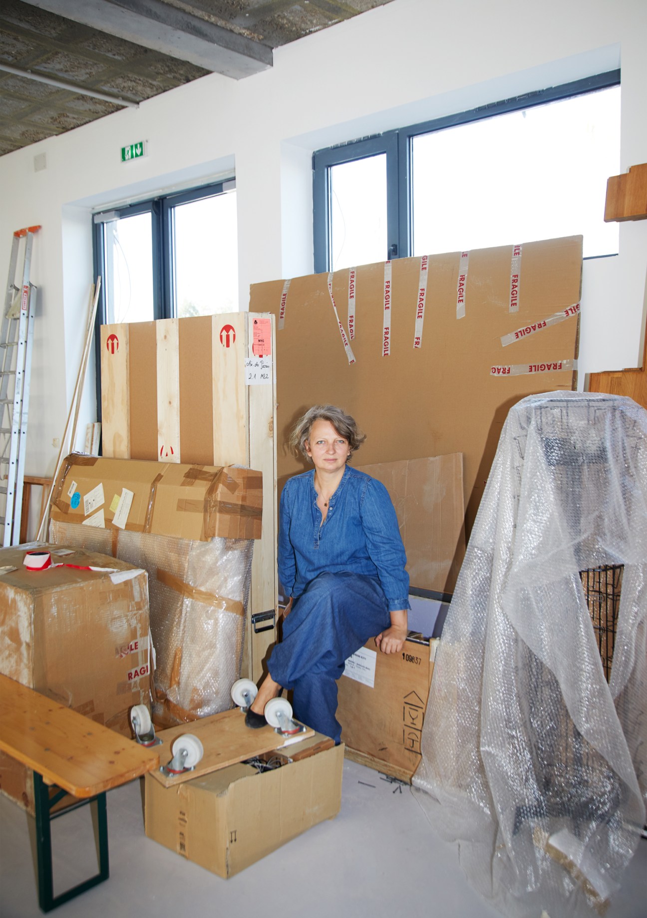 Portrait of Linda Grabe standing in an art gallery space