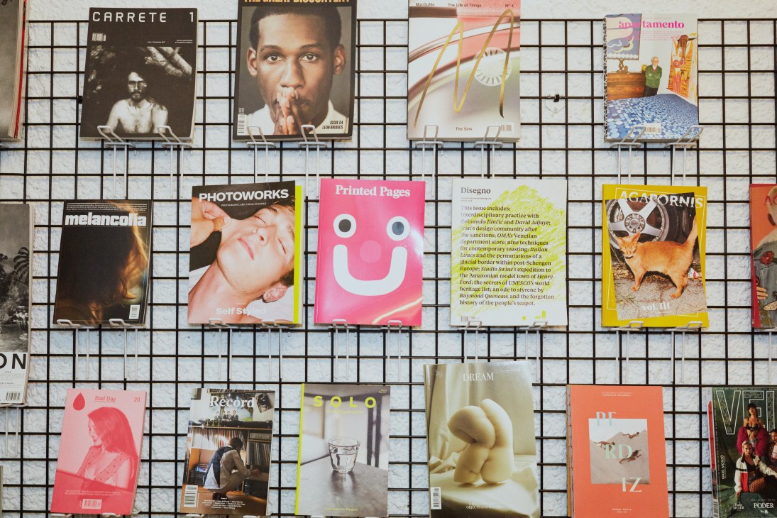 Magazine display rack with various publications including design and culture magazines