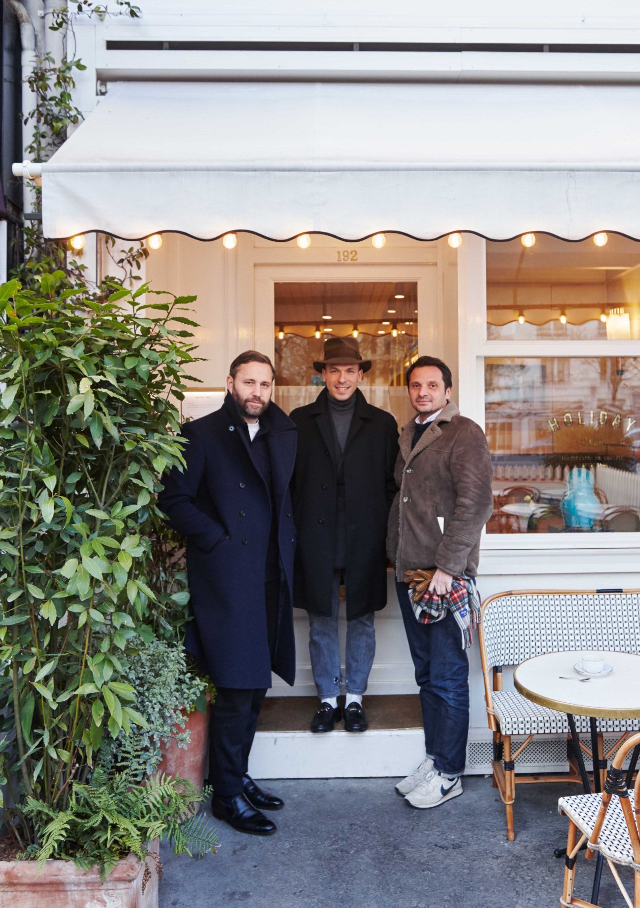 Marc Beaugé, Gauthier Borsarello and Franck Durand standing outside Holiday Café in Paris's 16th arrondissement.
