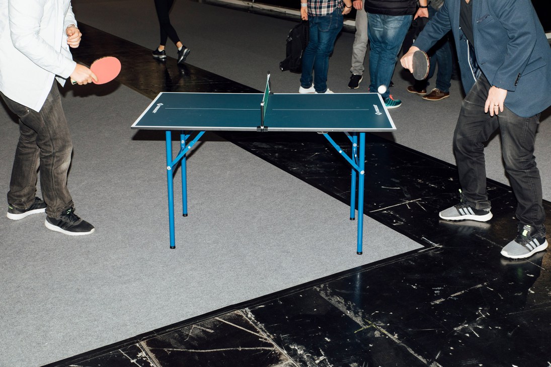 People playing ping pong at the Ispo sportswear fair in Munich.
