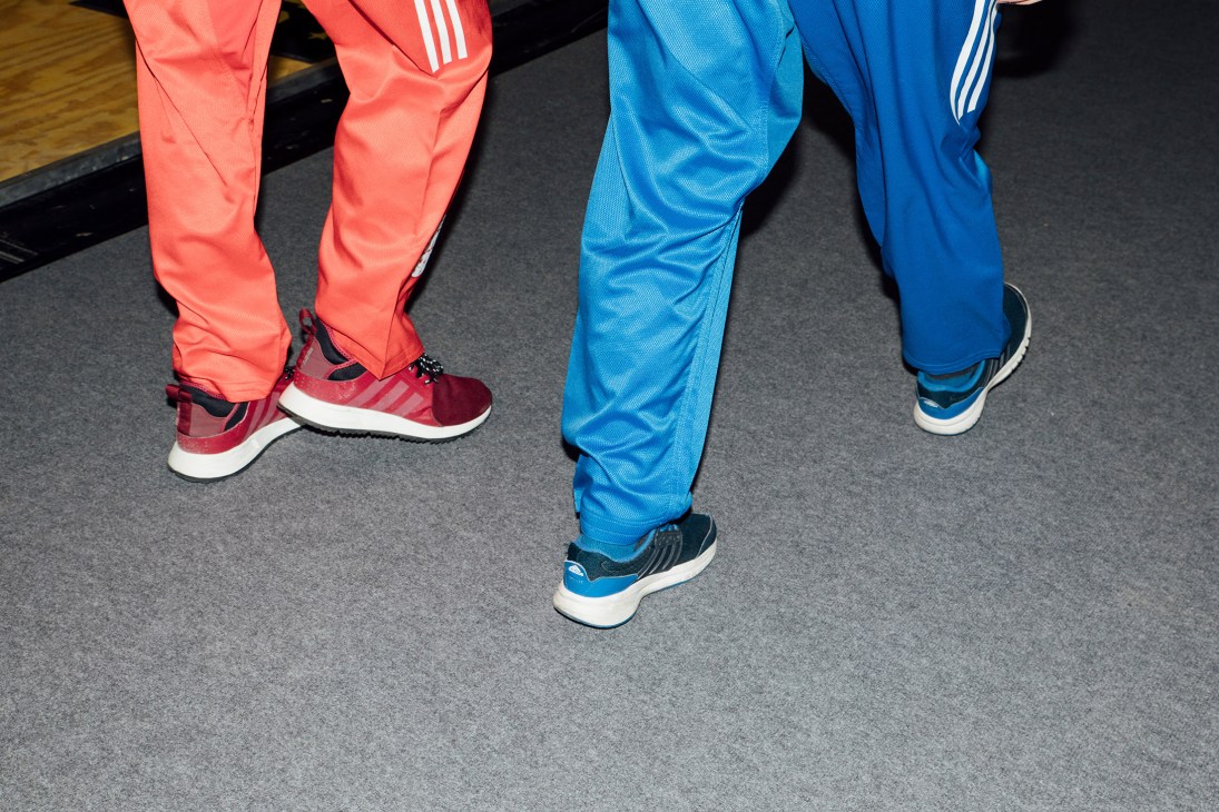 Close-up of athletic shoes and Adidas sportswear worn at the Ispo fair in Munich.