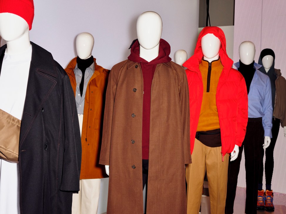 Mannequins displaying Uniqlo clothing collection including coats, jackets and casual wear in various colors